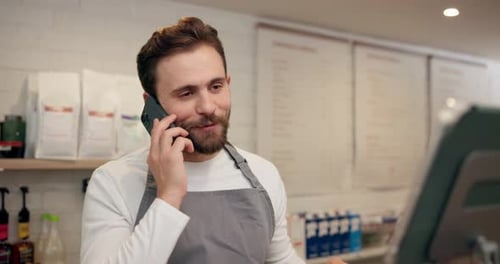 Man, waiter and talking with phone call at cafe for online order, customer reviews