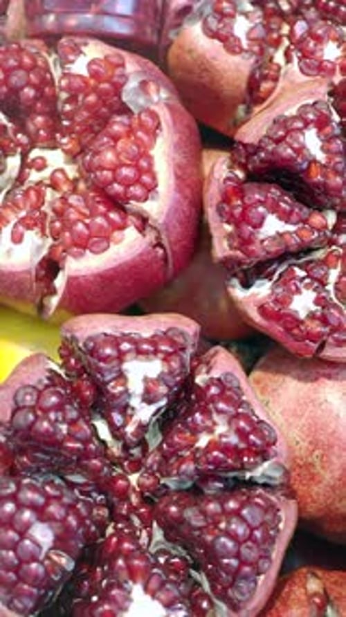 Fresh and Vibrant Pomegranates Displayed Beautifully in the Local Market for Sale