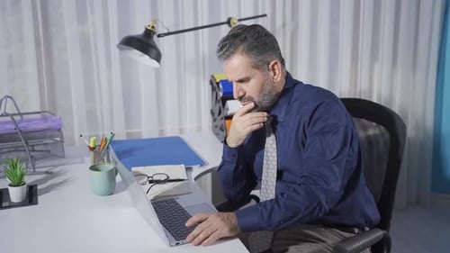 Mature businessman working in the office.