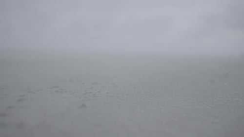 Slowmotion closeup of sand moving along the beach in the wind LOG