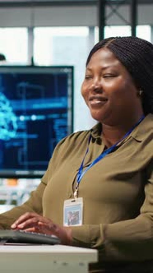 Vertical Video Female Technician Using Computer to Write Code Developing Machine Learning API