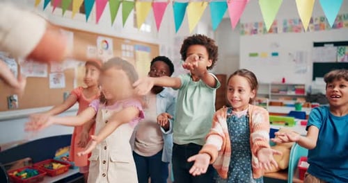 Children Dancing Together in a School Classroom