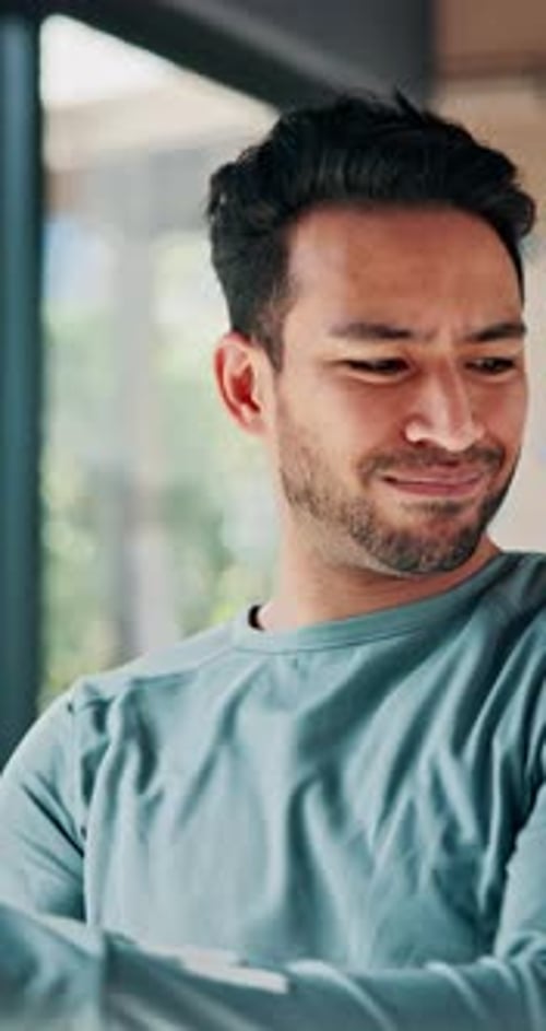 Young Man Stretching Indoors for Health and Fitness