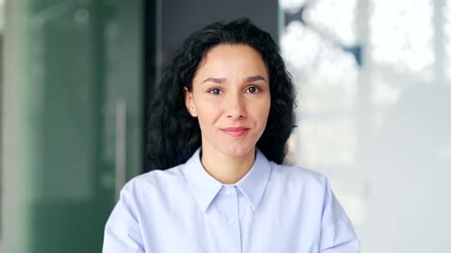 Webcam view Close up. Young female employee watching video call training looking at camera