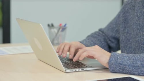 Close up of Male Hands Typing on Laptop