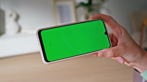 Hand Using Touchscreen Phone with Chroma Key Screen