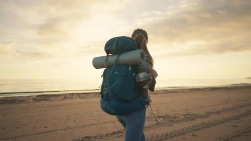 Woman Tourist Walks on Sandy Sea Beach Female Traveler Carrying Big Backpack with Touristic