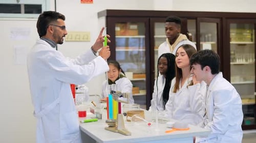 Chemistry Professor Explaining Experiment to Students in University Laboratory
