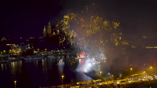 Fireworks over Wawel Royal Castle and Vistula river in Krakow during Dragon Parade, Poland.