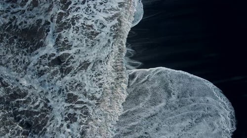Aerial view top view - A beautiful black sand beach waves Reynisfjara Vik in Iceland