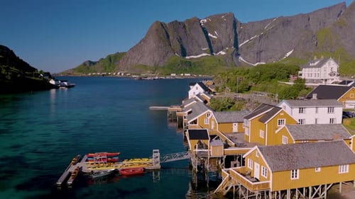Breathtaking Coastal Village with Colorful Houses and Majestic Mountains in Norway