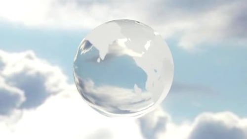 Transparent Glass Earth Globe Rotating in Cloudy Sky Loop