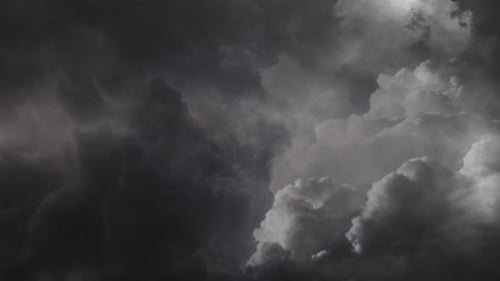 4k view of dark clouds and thunderstorm in the dark sky
