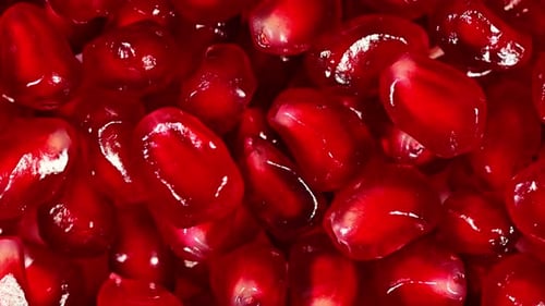 A close up of pomegranate fruit seeds