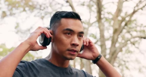 Headphone, fitness and nature running man, outdoor or park listening to motivation music