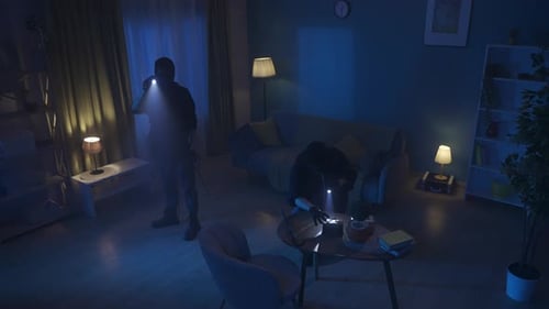 Intruders Searching Home at Night with Flashlights