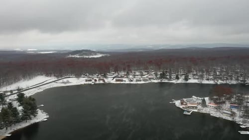 Foggy Winter Lake in Snowy Woods - Drone Countryside Footage