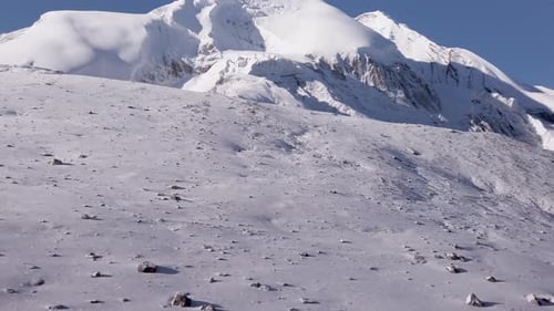 panoramic view of thorung la pass covered by snow during a sunny day himalayan mountains nepal, famo