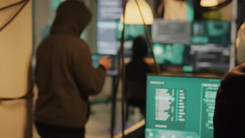 Busy programmers working at office computer desk