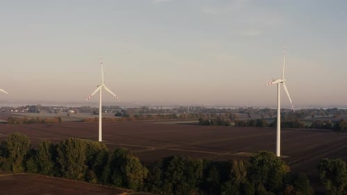 Aerial View Green Energy Concept With Wind Turbines At Sunset In Countryside