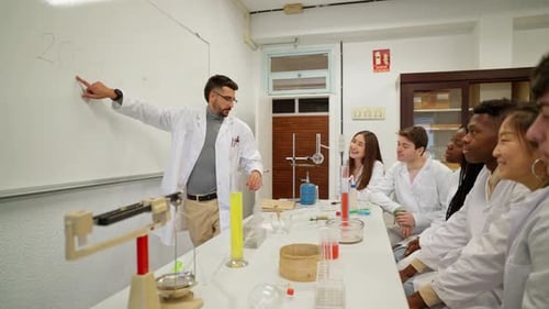 Science Teacher Explains Chemistry to Students in Classroom