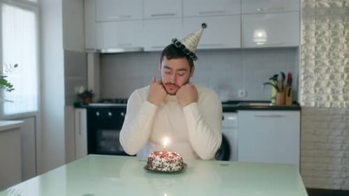 Man with Cake at Home on his Birthday