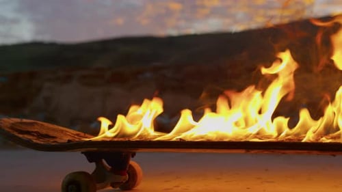 Skateboard on Fire Being Ridden at Dusk