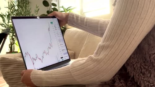 Stock Market Analysis on Laptop at Home