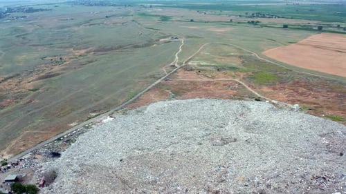 Aerial Drone View of Large Landfill Surrounded By Fields Environmental Pollution Concept Waste