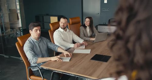 Team Meeting in a Modern Office Setting