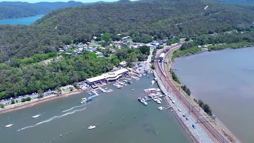 Drone aerial landscape of Brooklyn rural town suburbs with housing surrounded by bushland trees and