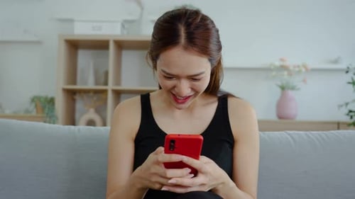 Woman Excited About Something on Her Phone