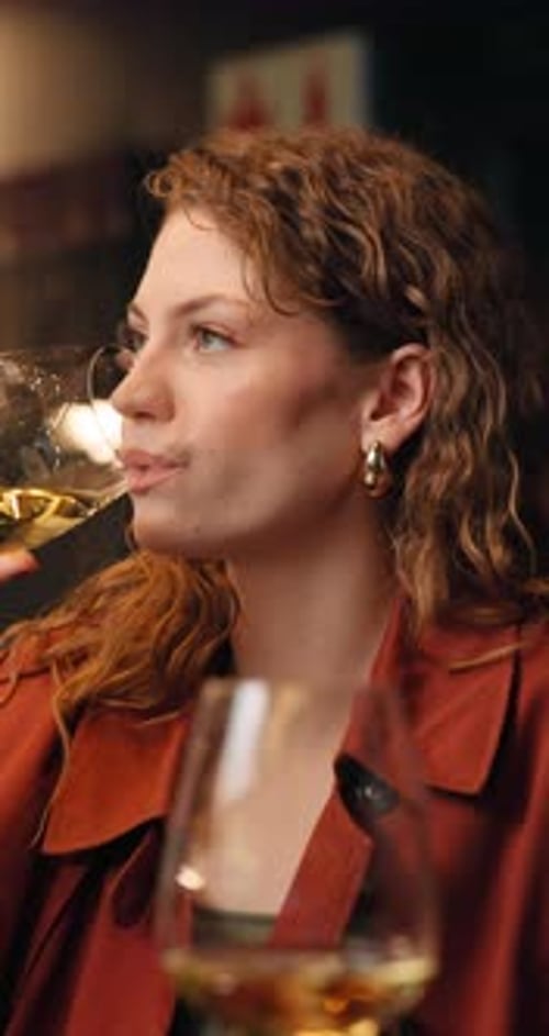 Wine, drinking and woman in restaurant for party, social event or waiting for date in evening