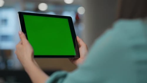 Anonymous businesswoman conducting green screen mockup webinar at modern office