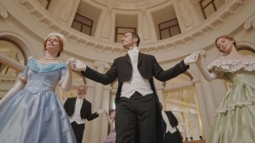 Elegant People in Period Clothing Attending a Ball