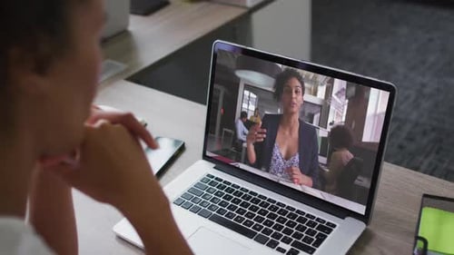 Woman Attends Virtual Meeting in Bright Office