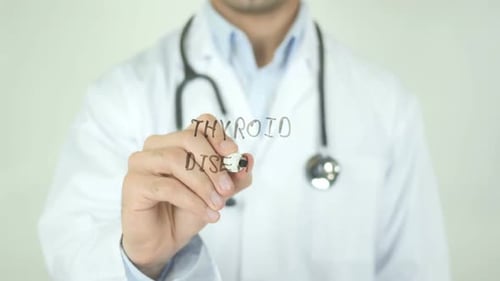 Thyroid Disease, Doctor Writing on Transparent Screen