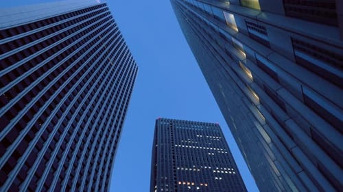 Low Angle Gliding Shot of Skyscrapers in the Tokyo. Financial District. Skyscape and Cityscape in t