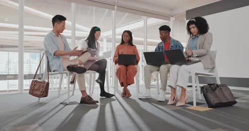 Diverse Team Collaborates in Modern Urban Workplace