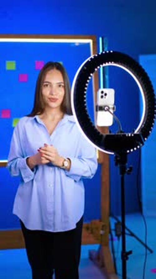 Woman Presenting to Phone Camera With Ring Light