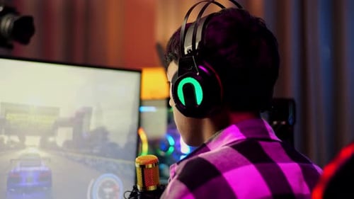 Young Adult Gaming at Computer at Night