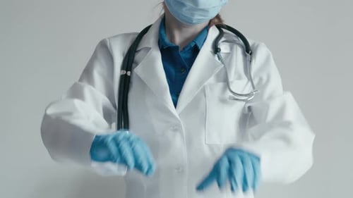 Doctor Making Heart Shape with Hands in Hospital