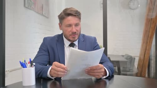 Man Celebrates Good News in Office