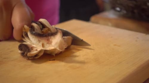 Slicing Brown Mushrooms on Cutting Board