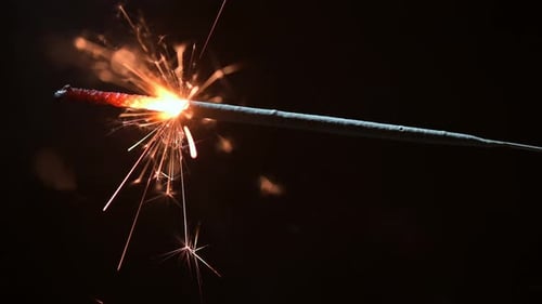 Sparkling Metallic Sparkler Emitting Hot Sparks in the Dark