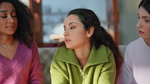 Sad Brunette Discussing Problem with Supportive Friends Sitting Couch Closeup