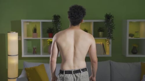 Shirtless Muscular Man Showing Back Muscles