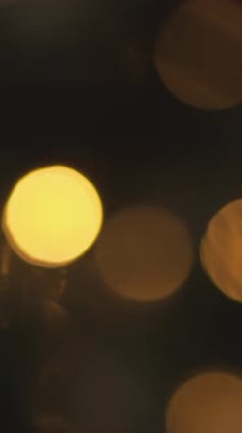 Golden Bokeh Lights Softly Glowing in a Dreamy Abstract Background Creating a Warm and Festive