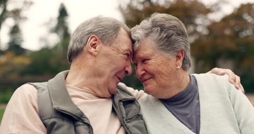 Love, happy and senior couple hug in a park with conversation, romance and bonding