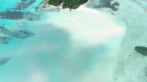 Aerial view of tropical island and beach, Maldives.